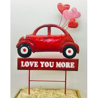 Red Car w/Love You More sign on Two Poles 